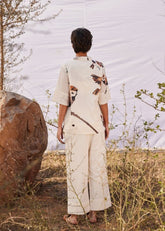 A Model Wearing White Cotton Mul Chidiya co ord set curated by Only Ethikal